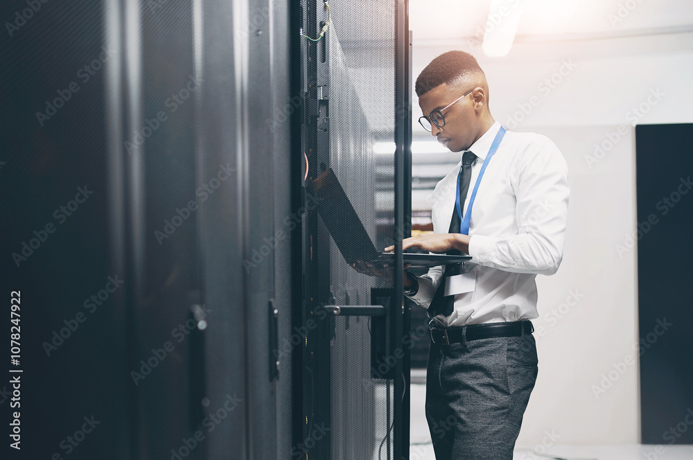 Man, technician and server room with laptop for software, hardware or network repair at office. Male person, IT engineer or fix with computer for technical solution, internet service or system backup Man, technician and server room with laptop for software, hardware or network repair at office. Male person, IT engineer or fix with computer for technical solution, internet service or system backup