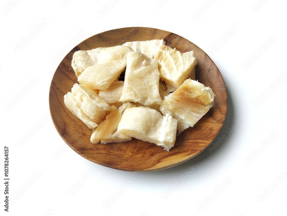 Dry salted fish on wooden plate isolated on white background with high angle view setup Dry salted fish on wooden plate isolated on white background with high angle view setup