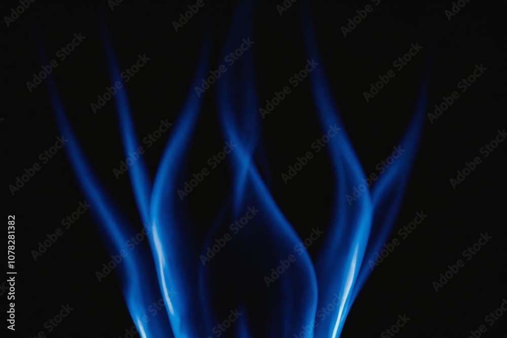Abstract blue flame swirls against black background Abstract blue flame swirls against black background