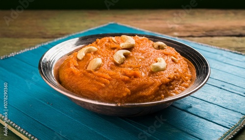 Gajar ka halwa is a carrot-based sweet dessert pudding from India. Garnished with Cashew/almond nuts and Served in a bowl over colourful/wood background. ai generated photo