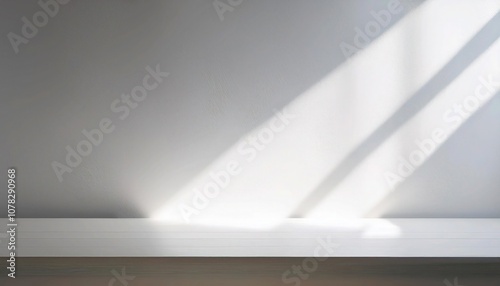Clean white wall with soft natural morning light.