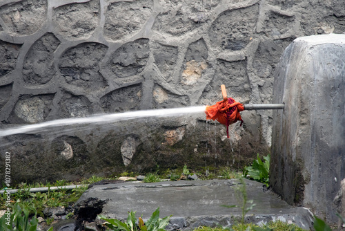 Water is getting leaked from a tap.