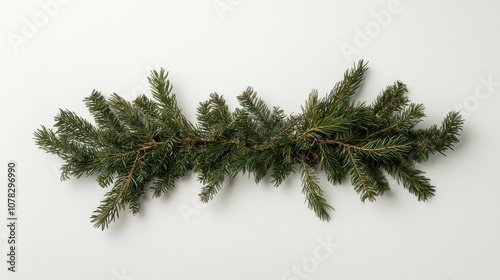 Festive straight pine garland with fir leaves against a white background, capturing the natural beauty of holiday decor in a clean composition.