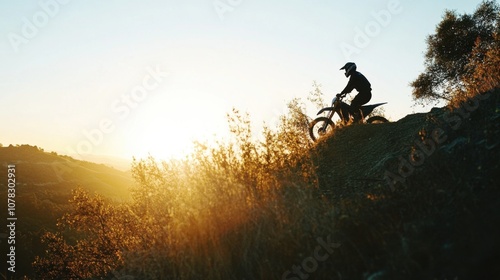 Rider Launching from Steep Incline at Dramatic Sunset photo