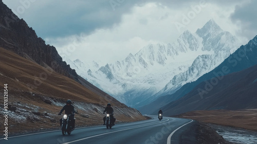 scenic drive along Leh Manali highway with motorcyclists enjoying breathtaking mountain views. dramatic landscape features snow capped peaks and rugged terrain