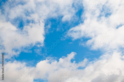 The photo shows blue sky and clouds