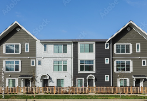 Canadian modern residential architecture, low-rise new townhouses. Neighborhood modern houses