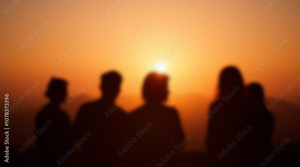 Blurred image of sunrise or sunset in nature in the mountains with silhouettes of people enjoying retreat and self-discovery Blurred image of sunrise or sunset in nature in the mountains with silhouettes of people enjoying retreat and self-discovery