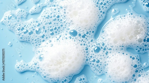 Wallpaper Mural Detergent foam bubbles in water, with scattered bubble clusters reflecting soft lighting. Blue background creates a clean look Torontodigital.ca