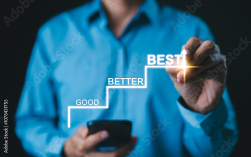 Progress from Good to Better to Best Concept. Businessman marks steps labeled 