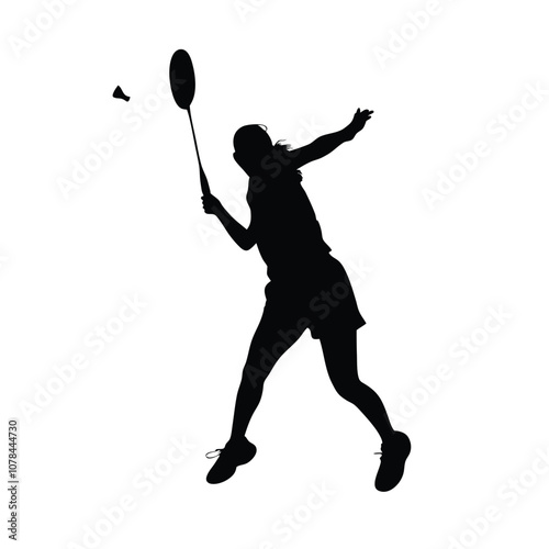 A woman is playing badminton and holding a racket. She is in the air and has a racket in her hand