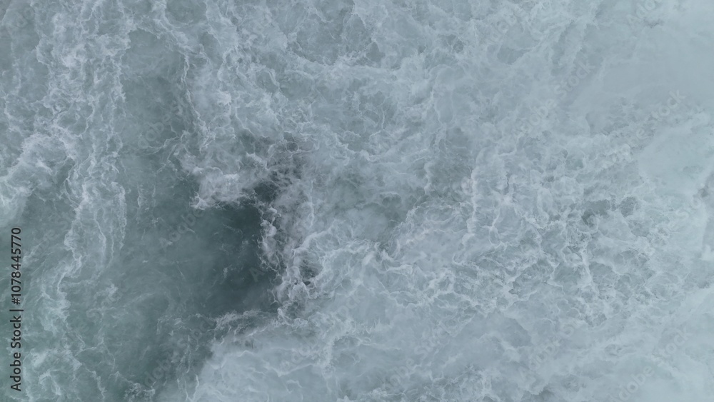 Fototapeta premium Water from waterfall turbulences from above