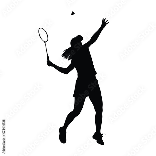 A woman is playing badminton and holding a racket. She is in the air and has a racket in her hand