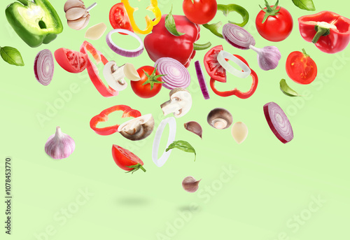Wallpaper Mural Many different fresh vegetables in air on light green background Torontodigital.ca