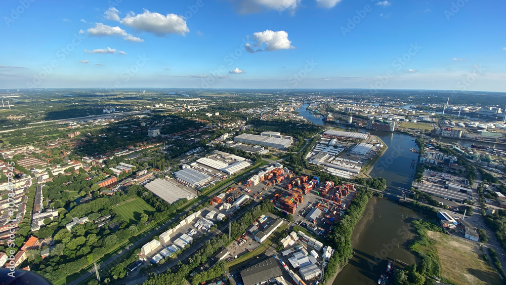 Aerial View of Industrial Cityscape and River on a Clear Day Aerial View of Industrial Cityscape and River on a Clear Day