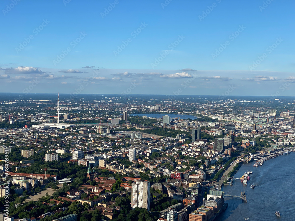 Stunning Aerial View of Cityscape and River Under Blue Sky Stunning Aerial View of Cityscape and River Under Blue Sky