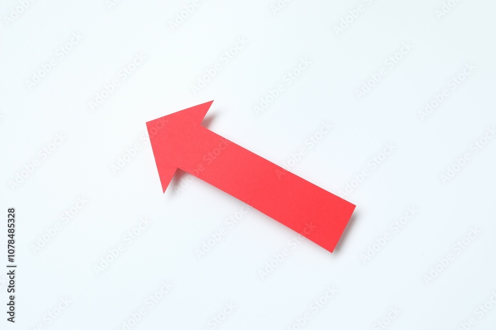 Paper arrow on white background, top view Paper arrow on white background, top view