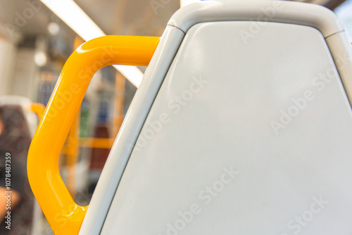 photo of the back of a train seat with built in handle photo