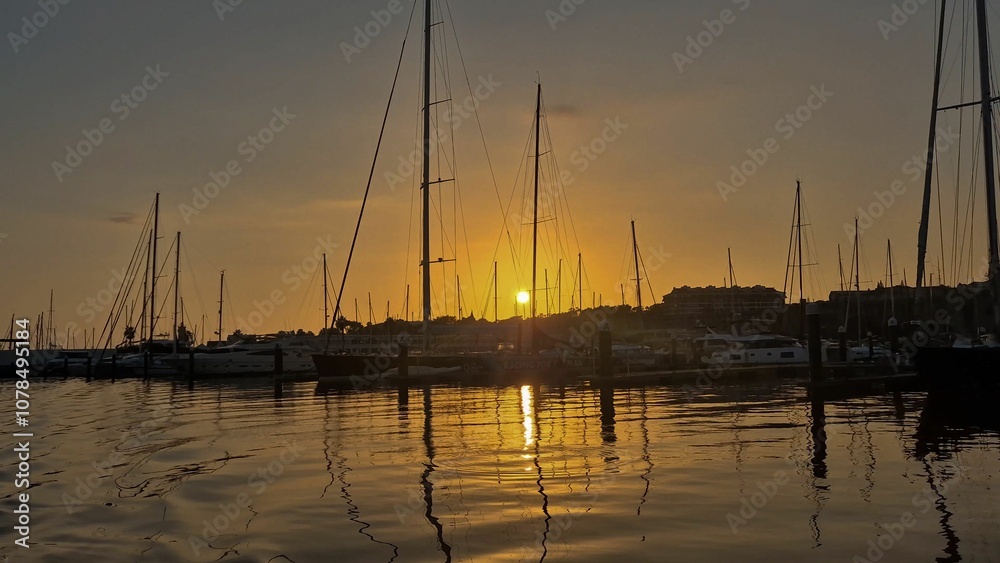 View from sunset reflected at sea and at boats anchored. View from sunset reflected at sea and at boats anchored.