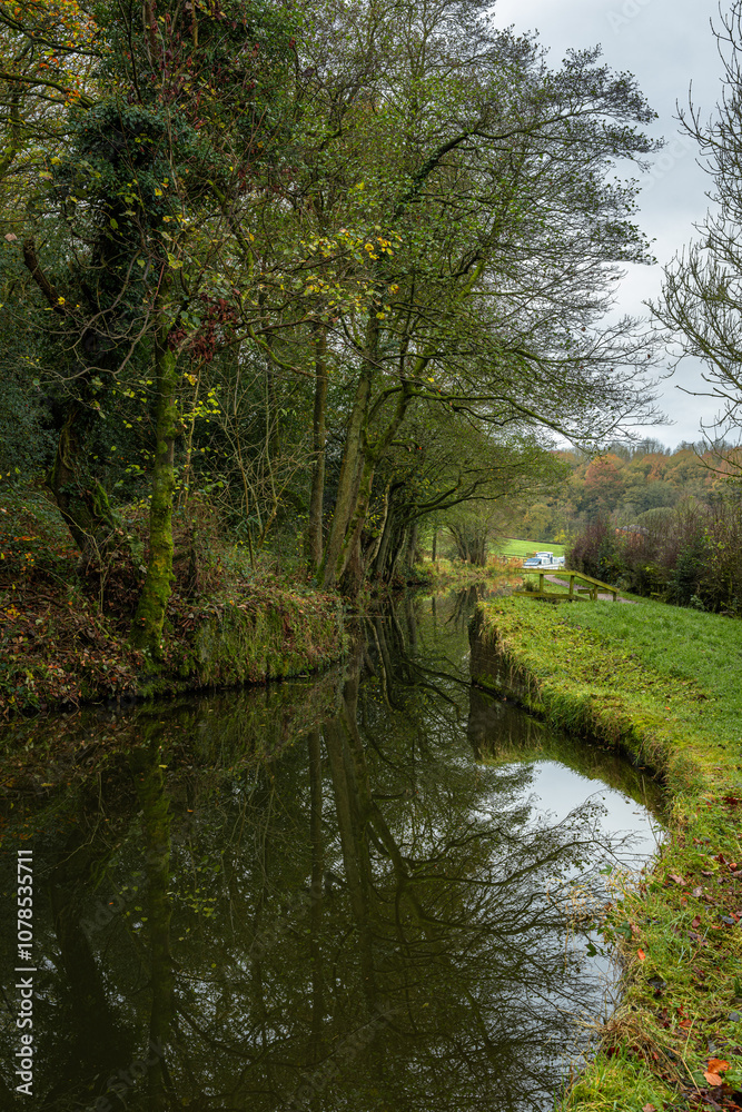 Autumn, fall tree and leaf colours along the Caldon canal at Denford in Staffordshire. Autumn, fall tree and leaf colours along the Caldon canal at Denford in Staffordshire.