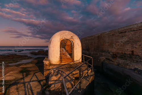 Newcastle Ocean Baths pump house at sunset photo