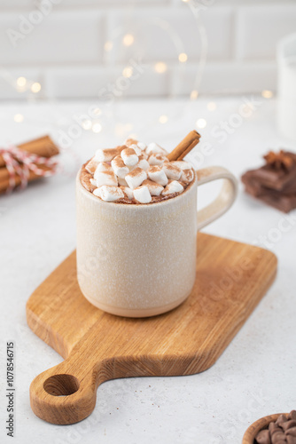 Delicious cocoa cup with whipped cream on wooden board