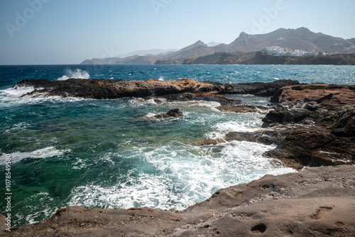 Rocky cliffs at Naxos Hora town in Naxos, largest of the Greek Cyclades islands in the Aegean sea, Greece photo