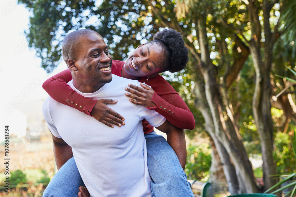 Joyful Couple Sharing a Playful Moment in the Park During a Sunny Day, Embracing Happiness and Love Joyful Couple Sharing a Playful Moment in the Park During a Sunny Day, Embracing Happiness and Love