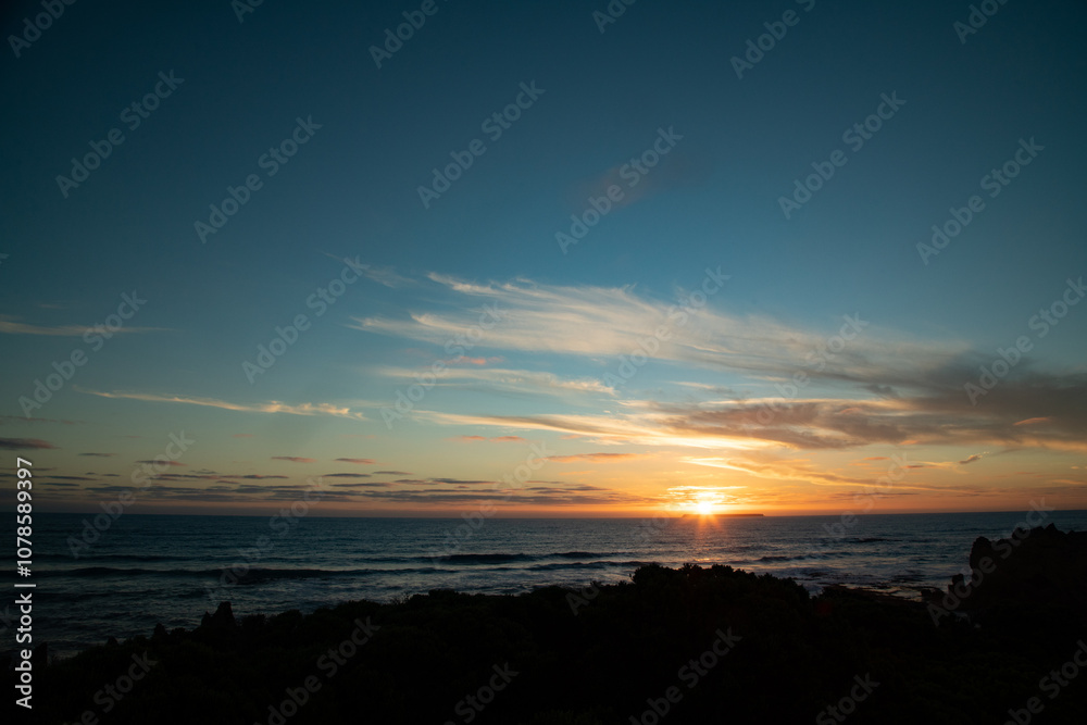 Sun setting behind Lady Julia Percy Island across the water from The Crags on The Great Ocean Road Sun setting behind Lady Julia Percy Island across the water from The Crags on The Great Ocean Road