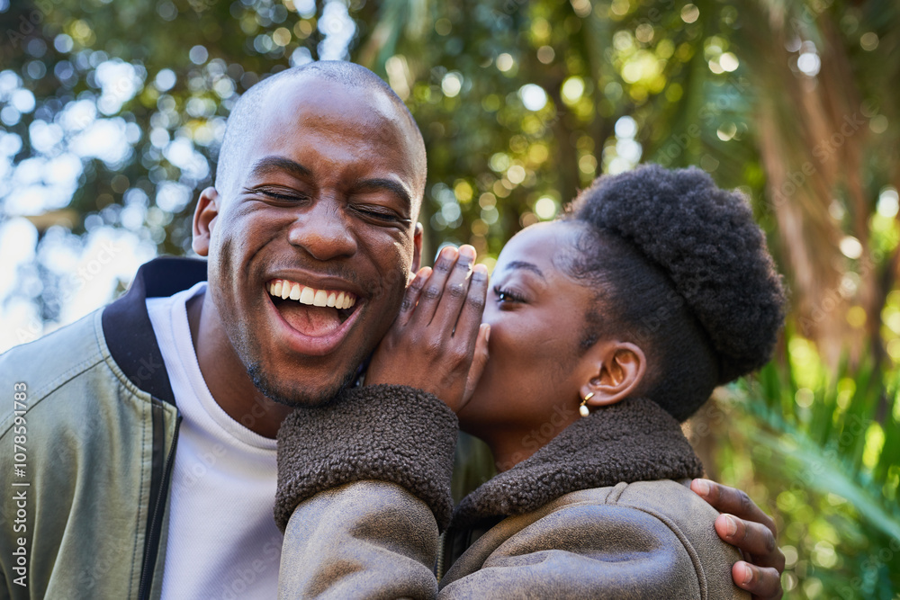 Fototapeta premium Joyful Couple Sharing Secrets Outdoors in a Sunlit Park