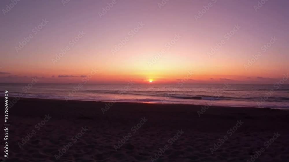 A tranquil beach scene captures a stunning sunset over the ocean, highlighting serene colors and reflection on calm waters. A tranquil beach scene captures a stunning sunset over the ocean, highlighting serene colors and reflection on calm waters.