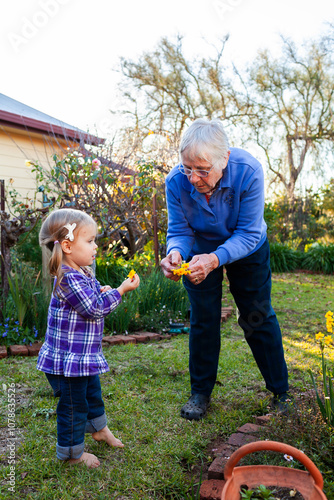 Senior woman with her granddaughter in the garden