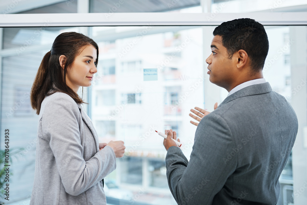 Business people, planning and discussion with glass board for meeting, brainstorming or schedule at office. Businessman, woman or colleagues with proposal for strategy or company vision at workplace Business people, planning and discussion with glass board for meeting, brainstorming or schedule at office. Businessman, woman or colleagues with proposal for strategy or company vision at workplace