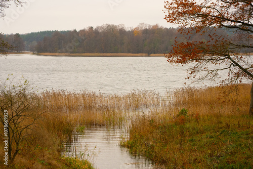 Beautiful lake in autumn, a stream flowing into it