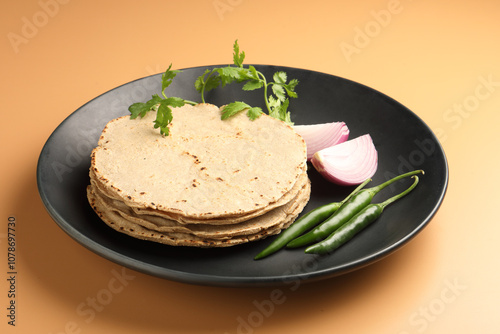 Jowar Roti or Jowar Bhakri is a staple in the Indian states of Maharashtra, Gujarat, and Karnataka. Sorghum is a versatile and nutrient-rich grain In Maharashtra  photo