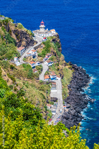 A view above the road leading down to the lighthouse at Arnel on the island of Sao Miguel in the Azores in summertime photo