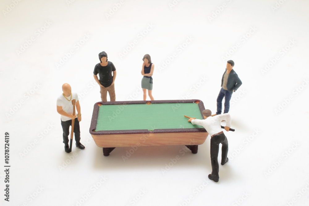 Miniature Figures Playing Billiards in a Recreational Setting Miniature Figures Playing Billiards in a Recreational Setting