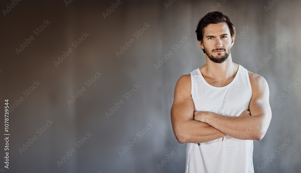 Arms crossed, fitness and portrait of man on mockup space in studio for training or workout. Exercise, muscles and strong with confident personal trainer on gray background for physical challenge