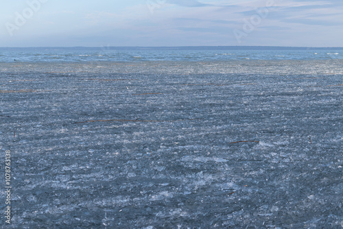 Frozen lake with ice sheets.