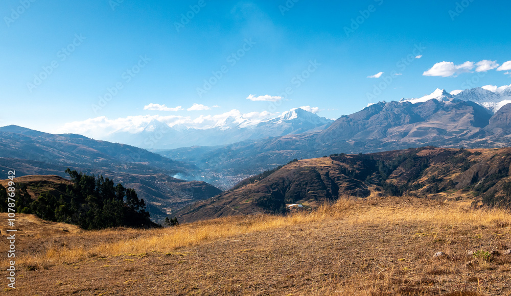 View of the White Mountain Range with Some Clouds Around in a Sunny Day in Huaraz in the Ancash Region, Peru View of the White Mountain Range with Some Clouds Around in a Sunny Day in Huaraz in the Ancash Region, Peru