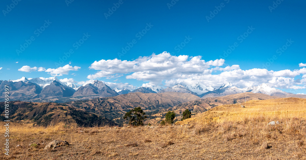 View of the White Mountain Range with Some Clouds Around in a Sunny Day in Huaraz in the Ancash Region, Peru View of the White Mountain Range with Some Clouds Around in a Sunny Day in Huaraz in the Ancash Region, Peru