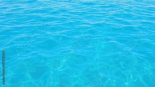 Pure blue turquoise water with gentle foam, creating mesmerizing patterns as the waves crash, calm, crystal clear, aqua