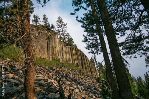 ‏Volcanic Hexagons rock formations in California’s Devil’s Postpiles National Monument. Incredible volcanic hexagons poles standing tall photo