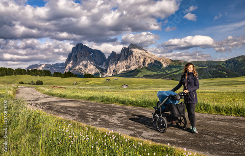 Alpe di Siusi or Seiser Alm, Hiking with stroller, Dolomites Alps Sassolungo and Sassopiatto mountains, Trentino Alto Adige Sud Tyrol, Italy, Europe
