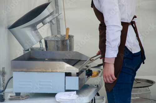 Close-up of the process of cooking food in an outdoor open kitchen