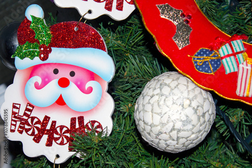 Santa Claus and colourful balls as decoration on christmas tree. selective focus