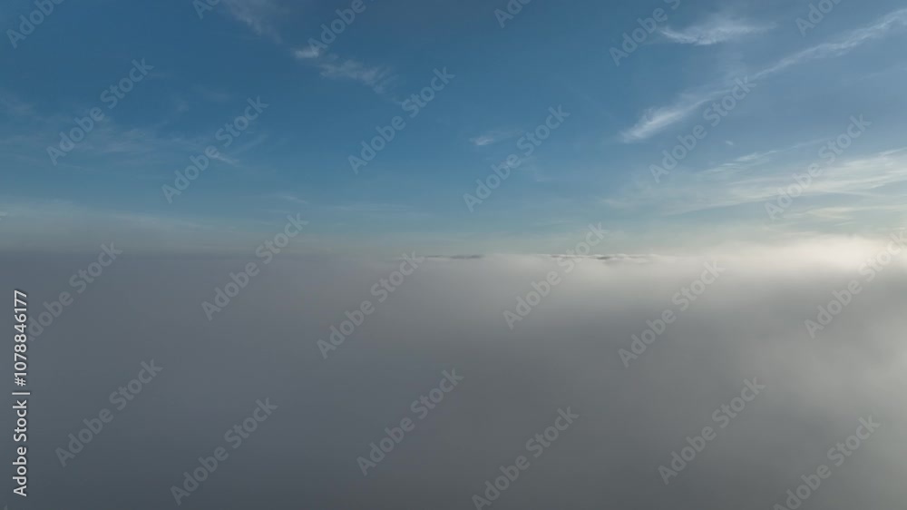 panning drone shot just above clouds at sunset panning drone shot just above clouds at sunset