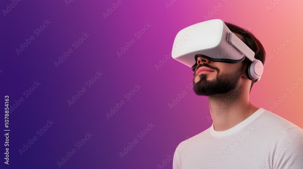 A man wearing a virtual reality headset is looking at a purple background A man wearing a virtual reality headset is looking at a purple background