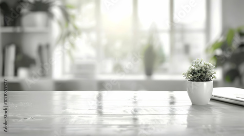 A Close-Up View of a White Desk with a Potted Plant, a Laptop, and a Window with a Blurred Background