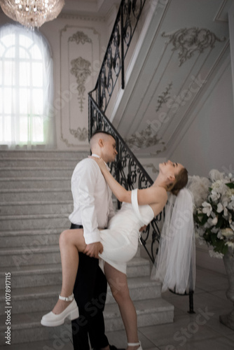 Newlyweds guy and girl. Wedding. White dress. Happiness.